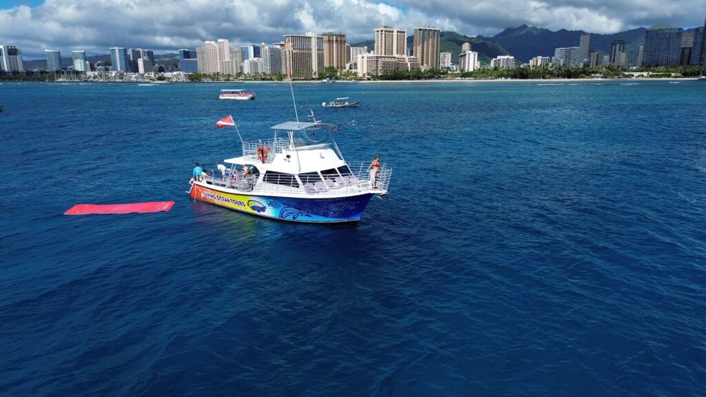 Snorkel boat near Waikiki skyline, a highlight of any Oahu daily itinerary.