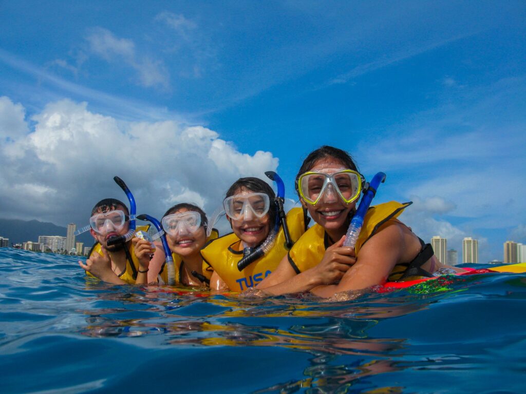 Guests on a snorkeling trip in Hawaii with Sunset Cruise Waikiki. 